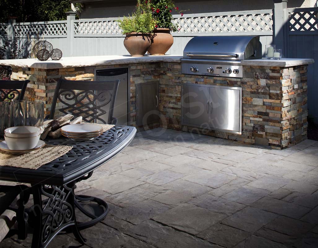 Norstone Ochre XL Stacked Stone Rock Panels on an outdoor kitchen with a stainless steel grill